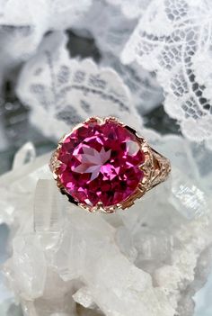 Natural Pink Topaz Ring Princess Design#29 Custom Made Inspired by Georgian and Victorian era filigree designs, I now offer this stunning reproduction in sterling silver with rose gold overlay. This fabulous ring is set with a 7.4ct VVS natural genuine pink topaz gemstone. The round full cut high quality gemstone is 13mm (1/2th of an inch) in diameter. The gemstone has excellent color and clarity. The inside of the band is marked 925 for sterling. Notice the beautiful intricate leaf prongs and f Victorian Princess, Displaying Jewelry, Pink Topaz Ring, Princess Design, Mystic Fire Topaz, Pink Accessories, Gold Overlay, Pink Topaz, Ring Rose Gold