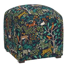 an animal themed footstool with trees, animals and leaves on blue background for children's bedroom or playroom