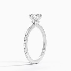 a diamond engagement ring on a white background