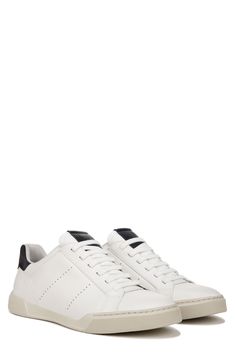 Slight perforations lend superior breathability to the smooth leather upper of this low-profile lace-up sneaker. Leather upper and lining/rubber sole Imported Classic Sneakers With Vented Sides And Round Toe, Classic Slip-on Sneakers With Contrast Sole, Classic Slip-on Sneakers With Rubber Sole, Classic Sneakers With Perforations In Synthetic Material, Classic Synthetic Sneakers With Perforations, Classic Sneakers With Perforations For Light Sports, Casual Low-top Slip-on Sneakers With Vented Sides, Sporty Slip-on Sneakers With Vented Sides, Classic Slip-on Synthetic Sneakers