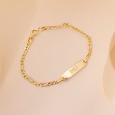 If you're looking for a creative and special gift for toddlers and children, this beautiful, engravable plain rectangular identification tag bracelet is a meaningful gift for any event. Entirely crafted in 14k Yellow Gold, which is safe for babies and children's everyday wear. Order a traditional ID bracelet today and we'll neatly package it into its own lovely gift box. Personalized Yellow Gold Rectangular Name Bracelet, Personalized Rectangular Yellow Gold Name Bracelet, Elegant Hypoallergenic Nameplate Bracelet, Classic Rectangular Name Bracelet, Tarnish Resistant, Classic 14k Gold Custom Name Bracelet, Classic Tarnish Resistant Name Bracelet, Personalized Rectangular Bracelets As Gifts, Personalized Rectangular 14k Gold Bracelets, Engravable Nameplate Bracelet In Yellow Gold