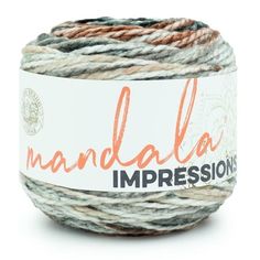 a ball of yarn with the words, mandala impressions on it's side