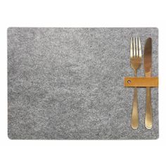 a place mat with two forks and a knife