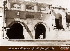 an old photo of two men in front of a building