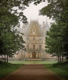 a large building with many trees around it