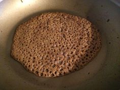 a cookie is cooking in a pan on the stove