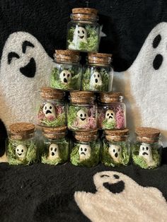 there are many jars with ghost faces in them