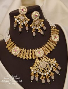 Description :- Gold-Plated Choker Necklace & Jhumka Earring Indian Jewelry Set | South Indian Temple Jewelry | Wedding Gift For Her Perfect for Indian weddings. All the raw material used in this product is of high quality and is handcrafted with love. Premium Quality and High craftsmanship 100% Satisfaction Guarantee: Long Lasting Plating, High-Quality Stones. Gifting: This pair of charming necklace and earrings come in a beautiful gift box, making it an ideal gift for birthday, wedding annivers White Jhumkas With Intricate Design For Reception, Reception White Jhumkas With Intricate Design, White Kundan Necklace With Intricate Design For Marriage, White Jhumkas With Intricate Design For Celebration, White Chandbali Bridal Sets Gift, White Intricate Design Jhumkas For Celebration, Heavy White Jewelry Sets For Marriage, White Intricate Design Jewelry For Marriage, White Festive Earrings For Wedding