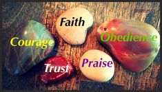 four stones with the words faith, courage, obedence and trust on them