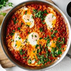 an egg dish in a pan with parsley on top