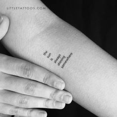 a woman's arm with the words, love and strength tattooed on her left arm