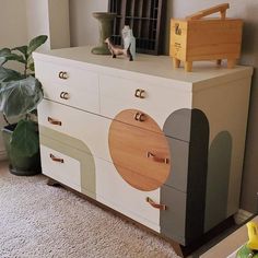 the dresser is painted in different colors and shapes