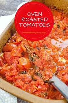 a casserole dish with tomatoes and herbs in it, topped with a spoon