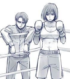 two people standing next to each other with boxing gloves on