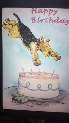 a birthday card with a dog jumping over a cake on it's side to blow out the candles