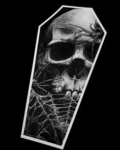 a black and white photo of a skull with spider web