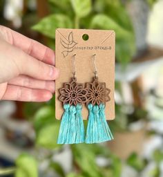 Get your free-spirit boho vibe on with these fun handmade macrame flower earrings!  These bohemian earrings were carefully hand knotted using soft recycled cotton cord on a wood flower piece. These dangle earrings are very lightweight. Makes the perfect gift for the hippie girl in your life.  Handmade with love in the USA.  *Nickel free earrings. Handmade with eco-friendly materials! I use high quality cord made from recycled cotton. Nearly all my products are made with recycled cotton or recycled polypropylene cord. I strive to be as eco-friendly as possible with all my materials and processes. ** Attention local buyers ** If you prefer to arrange for in-person pick up instead of having your item shipped to you, please message me after placing your order and I can refund any shipping cost Bohemian Adjustable Macrame Tassel Earrings, Adjustable Bohemian Drop Flower Earrings, Bohemian Tassel Earrings With Fringe For Spring, Spring Bohemian Turquoise Jewelry, Handmade Bohemian Tassel Earrings For Festivals, Turquoise Handmade Tassel Earrings For Festivals, Handmade Turquoise Tassel Earrings For Festival, Trendy Macrame Jewelry As Gift, Trendy Macrame Jewelry For Gifts