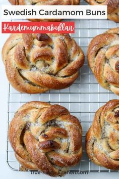 several cinnamon buns on a cooling rack with the words swedish cardamon buns