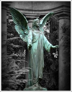 an angel statue with its wings spread out