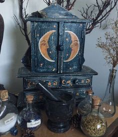 an old wooden table with various items on it