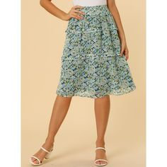 Inspired by romantic style, this skirt will lend some feminine style to your look. Made from lightweight chiffon, the tiered ruffle hem, midi length, and floral printed pattern overall, it completes a vintage silhouette. This sweet floral skirt is designed with a floaty tiered ruffle hem and a smocked waist. Pair it with flats or heels for a pretty and sweet style. The model is wearing an X-Small. Tiered Skirt With Elastic Waistband For Garden Party, Flared Ruffle Skirt For Garden Party, Flared Ruffled Skirt For Garden Party, Ruffled Flared Skirt For Garden Party, Knee-length Ruffled Skirt For Day Out, Flowy Knee-length Skirt With Ruffle Hem, Knee-length Flowy Bottoms With Ruffles, Knee-length Flowy Skirt With Ruffle Hem, Casual Chiffon Tiered Skirt