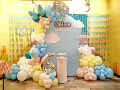 balloons and streamers decorate the entrance to a children's birthday party