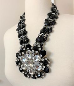 "A dramatic necklace & ear clip set by noted costume jewelry designer Lawrence Vrba, who worked for Miriam Haskell before launching his own line. The large scale pendant/brooch The large pendant can be removed from the necklace and worn as a brooch. The matching ear clips Four Strand, The necklace, brooch and the earrings are signed and made in USA In very good condition. Necklace 21\" long, Brooch 4\" - clip on earrings 1\" Pictures are part of the description so please look at all the pict Black Pendant Costume Jewelry Necklace, Luxury Black Necklace With Large Beads, Luxury Black Multi-strand Jewelry, Elegant Black Faceted Crystal Necklace, Dramatic Necklace, Black Multi-strand Costume Jewelry Necklace, Jet Black, Multi Strand Necklace, Black Crystals