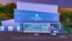 the outside of an ocean aquarium by ben's bundles storefront with trees and mountains in the background