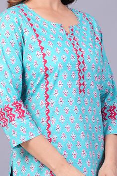 Blue Printed Straight Kurta, Blue Straight Kurta With Printed Border, Blue Printed Split Neck Tops, Cotton Printed Split Neck Tops, Cotton Split Neck Printed Tops, Festive Straight Kurta Top With Bandhani Print, Printed Cotton Tops With Split Neck, Cotton Printed Top With Split Neck, Blue Cotton Tops With Ikat Print