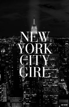 new york city girl in black and white with the empire building lit up at night