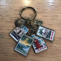 there is a keychain that has pictures on it and the words japan are in different languages