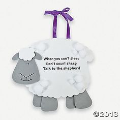 a sheep hanging ornament with a purple ribbon around it's neck that says, when you can't sleep, don't count sheep talk to the shepherd