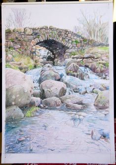 a drawing of a stone bridge over a stream with rocks and grass in the foreground