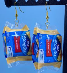 Who doesn't love mini brands !! Why not wear what you eat lol These adorable Kraft cheese singles are the perfect way to show off your love for food Each Kraft American cheese dangles from a hypoallergenic hook earring Cheese Jewelry, Kraft Cheese, Sliced Cheese, Crazy Earrings, Brand Earrings, Funny Jewelry, Mini Brands, Weird Jewelry, Funny Earrings