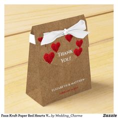 a brown paper bag with red hearts on it