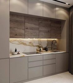 a kitchen with marble counter tops and cabinets