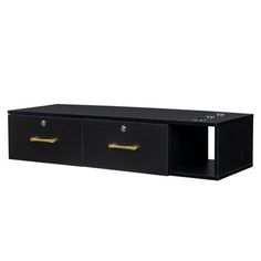 a black cabinet with two gold handles and drawers on the bottom, it is open to reveal