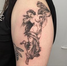 a woman with a tattoo on her arm