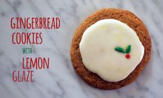 a gingerbread cookie with lemon glaze on a marble countertop next to the words gingerbread cookies with lemon glaze