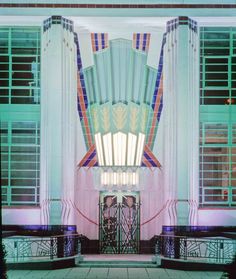 an art deco building with columns and windows