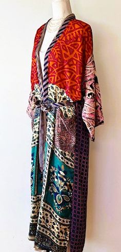 Luxury Silk Kimono Duster is elegant and striking. Made from the highest caliber silk. This Kimono has a beautiful finish, printed in the classic style. Patterned print incorporates split print blocks Prints are balanced between a soft jacquard, small print floral and textured crepe. Creates depth, interest, and designer appeal. Luxurious fabric, soft, opaque. The perfect duster for cocktail parties, resort, beach or poolside cover-up. Adapts well to a duster coat or dress. A stunning mix of dee Elegant Multicolor Printed Kimono, Fitted Multicolor Silk Kimono, Bohemian Red Silk Kimono, Elegant Multicolor Silk Kimono, Resort Beach, Kimono Duster, Cocktail Parties, Luxury Silk, Small Print