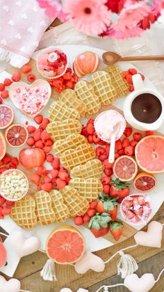 a plate topped with waffles covered in fruit