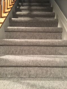 the carpeted stairs in this house are clean and ready for us to walk down