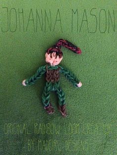 a knitted doll laying on top of a green carpet next to the words, johanana mason