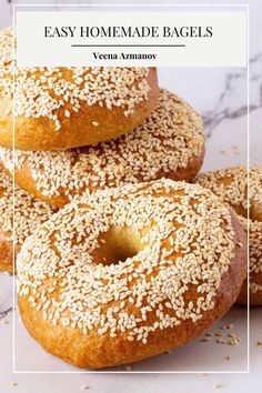 three bagels with sesame sprinkles on top and the words easy homemade bagels above them