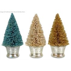 three tinsel christmas trees in small silver pots