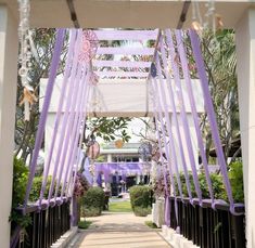 the walkway is decorated with purple ribbons and flowers