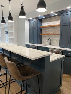 Cambria quartz countertops 
Silgranit sink 
Marble backsplash 
Custom cabinets in “Lead Gray” by Benjamin Moore Coastal Basement Bar, Navy Basement Bar, Basement Corner Bar, Basement Bar With Island, Simple Basement Bar Ideas, Lake House Basement, Basement Wet Bar, Kaufmann House, Home Bar Plans