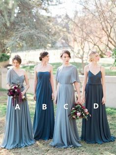 four bridesmaids in long dresses standing next to each other