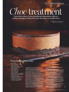 an advertisement for chocolate cake on a table